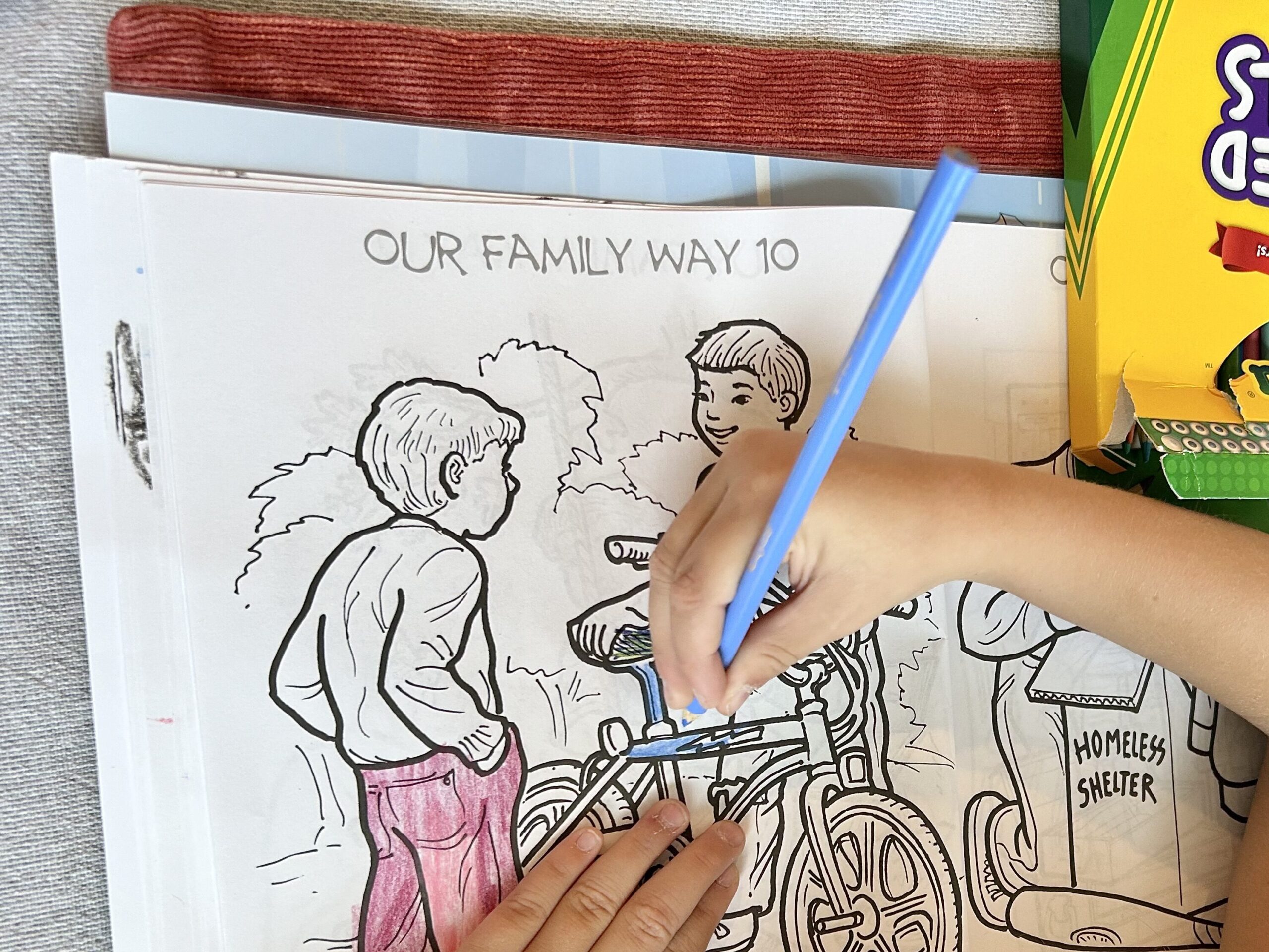 girl coloring in family way coloring book