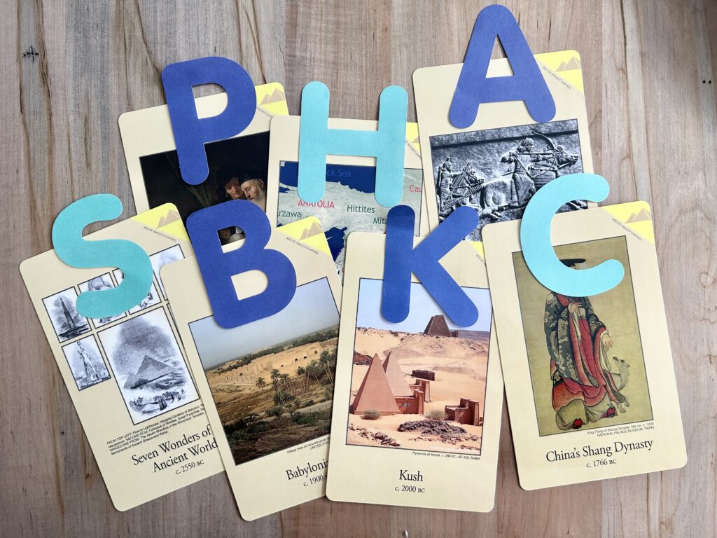 classical conversations timeline cards with large paper letters on them.