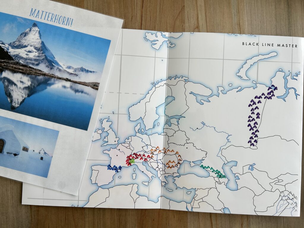 european mountains drawn on laminated europe map