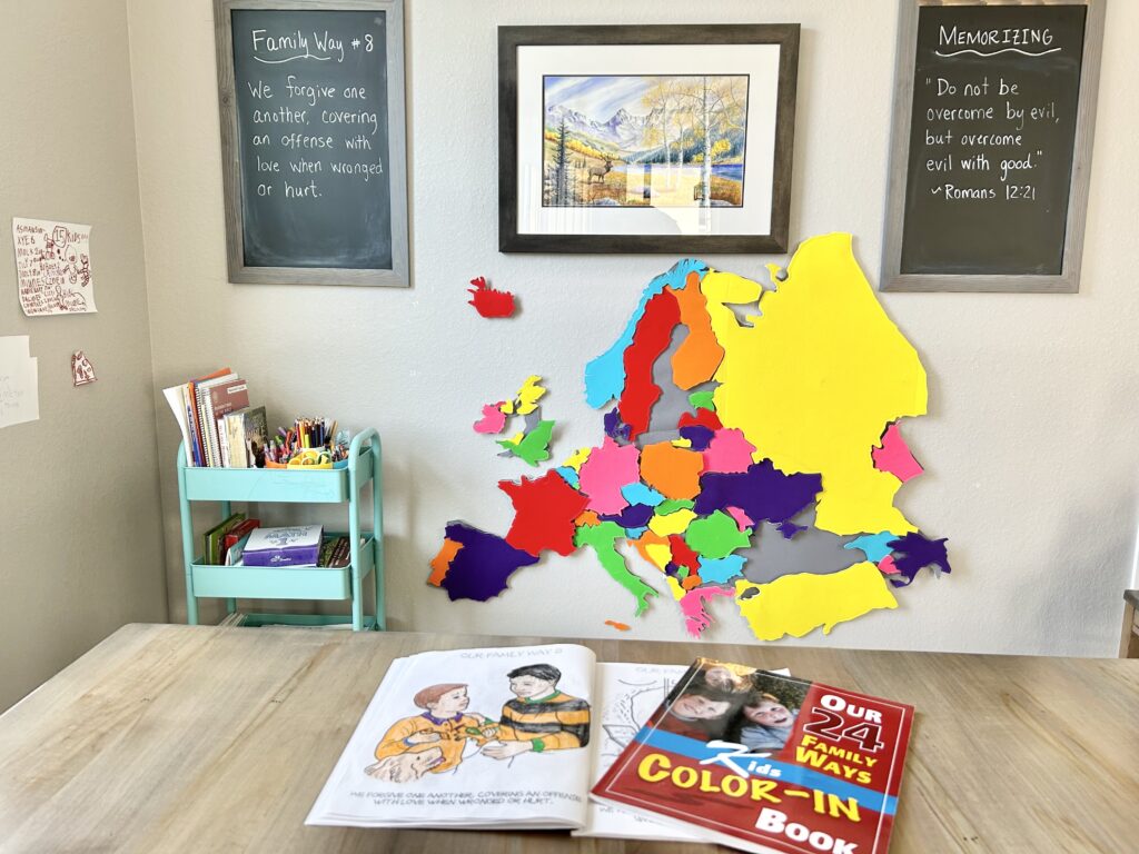 24 family ways coloring books and chalkboard by kitchen table