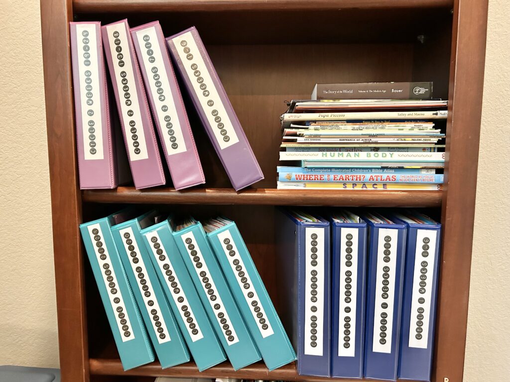 binders with cycle 2 homeschool material in them