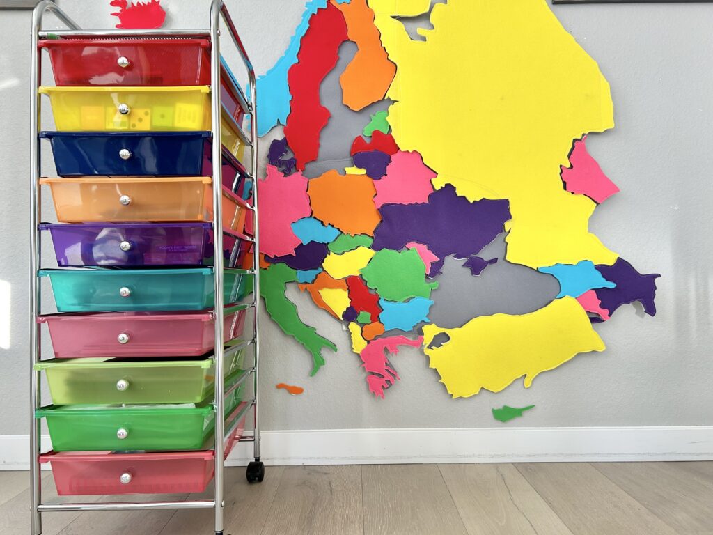 homeschool craft supplies cart in front of felt europe map