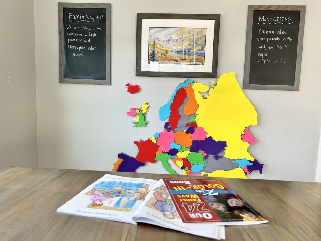 24 family ways coloring books and chalkboard by kitchen table