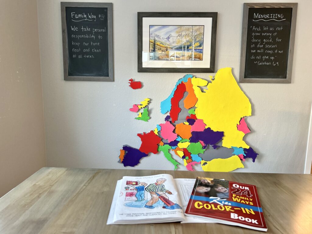 24 family ways on chalkboard and large felt europe map