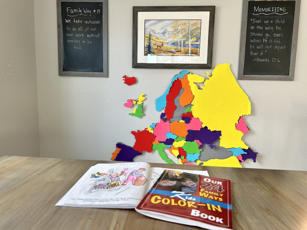 24 family ways coloring books and chalkboard by kitchen table